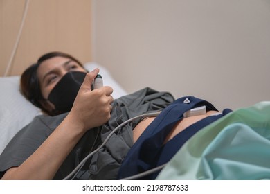 Pregnant People Use Fetal Monitor On Hospital For Uterine Contraction Recorder. 