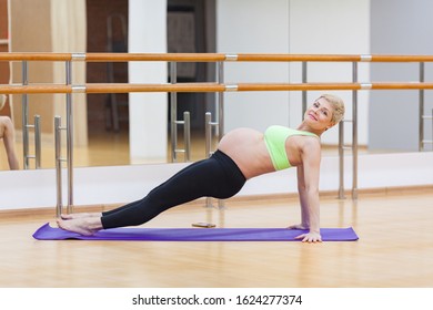 Pregnant performs stretching, Pregnant performs stretching and pulls neck, pulls his back