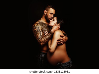 Pregnant sensual. Couple in love pregnant cuddling, waiting for baby. Real romantic passionate moment