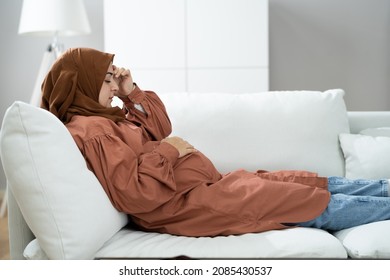 Pregnant Sick Woman With Headache, Discomfort And Pain