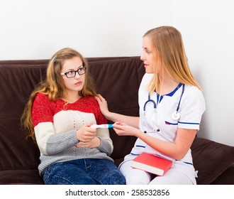 Pregnant Teenager At The Gynecologist's Getting Advice.