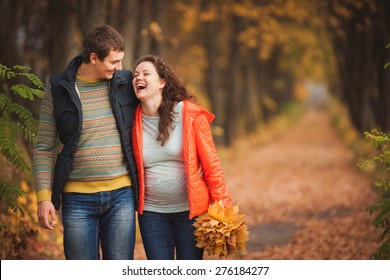 Pregnant woman in the autumn on the nature
