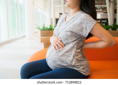 Pregnant Woman With Back Ache. Back Pain During Pregnancy.