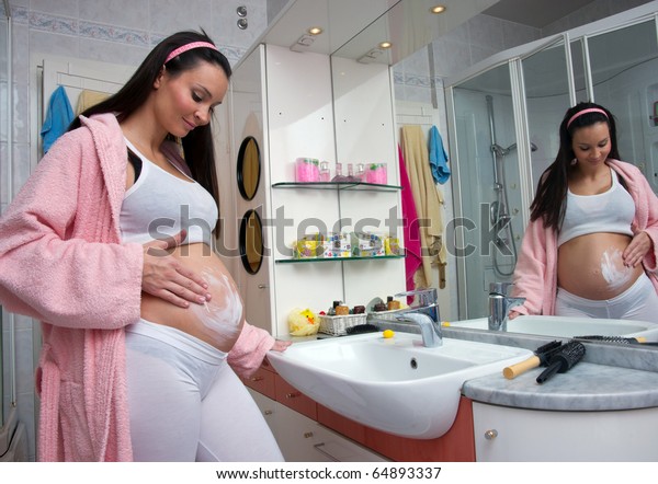 Pregnant Woman Bathroom Rubbing Belly Cream Stock Photo ...