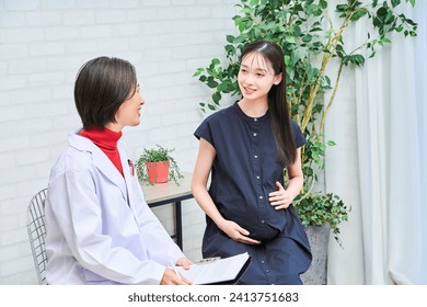 Pregnant woman being examined at the hospital - Powered by Shutterstock