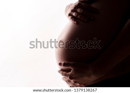 Similar – Image, Stock Photo Pregnant woman holding her tummy