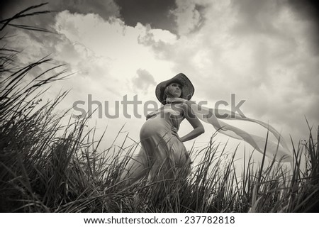 Similar – beautiful young woman siiting outdoors in forest, dreaming with closed eyes in serene pose