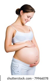 pregnant woman caressing her belly over white background