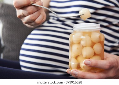 Pregnant Woman With Craving For Pickled Onions