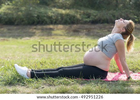 Similar – Woman in sports wear with earphones looking smartphone