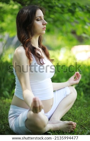 Similar – Young woman doing yoga in nature