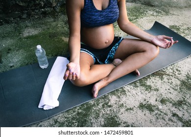 pregnant woman doing yoga in rural areas