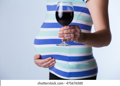 Pregnant Woman Drinking, Causing Harm To Her Unborn Fetus, By Giving It Fetal Alcohol Syndrome.