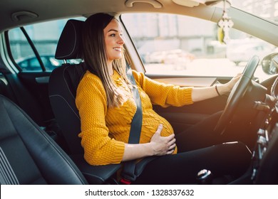 Pregnant Woman Driving With Safety Belt On In The Car.