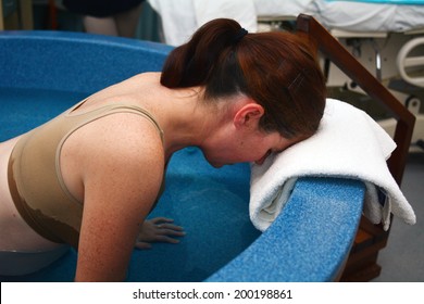 Pregnant Woman During Natural Water Birth.