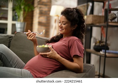 Pregnant woman eating fuit at home. Beautiful pregnant woman enjoy in healthy meal	 - Powered by Shutterstock