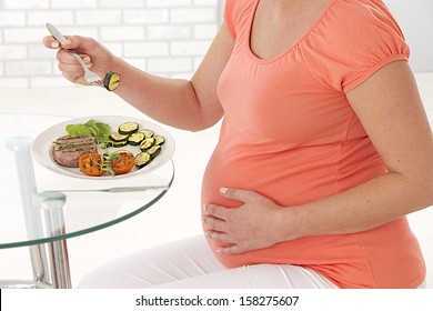 pregnant woman eating healthy food