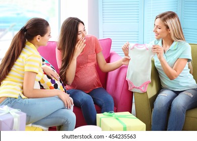 Pregnant Woman And Friends At Baby Shower Party