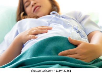 Pregnant Woman Gets Painful Or Hurt Of Her Belly. Mother Gets Suffered Because Mother Nearly Gives Birth Her Baby Or Children. It’s The First Time Of Her Life. It's Sign Of Preterm Infant. Suffer Face