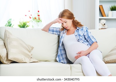 pregnant woman with a headache and pain