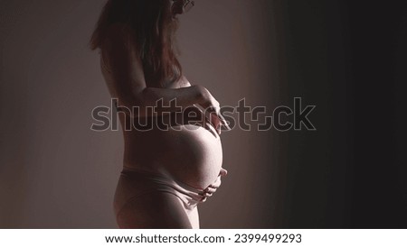 pregnant woman. health pregnancy motherhood procreation concept. close-up belly indoors of a pregnant woman. woman waiting for a newborn baby. pregnant woman holding her belly sunlight