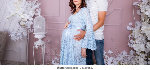 Pregnant woman with her hands on her belly - Shutterstock ID 741596527