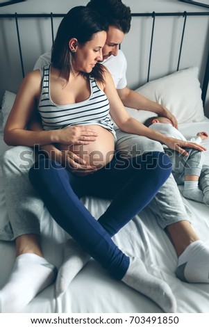 Similar – Pregnant woman embraced by her husband