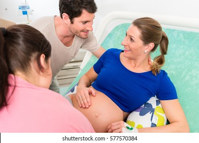 Pregnant Woman And Her Man In Delivery Room