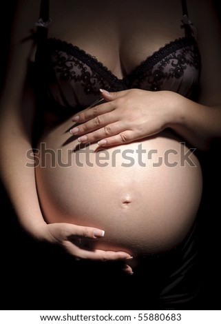 Pregnant woman hold the belly