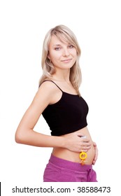 Pregnant Woman Holding Dummy Over White, First Trimester