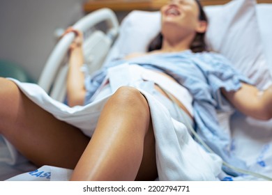 A Pregnant Woman In Labor In The Hospital, Screamed And Pushing The Baby Out In The Delivery Room. Childbirth.