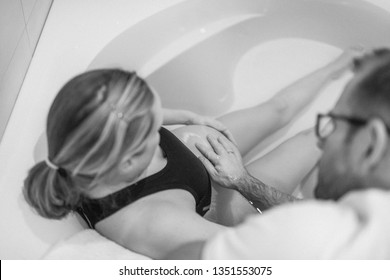 Pregnant Woman In Labour, Labor,  During Childbirth, Giving Birth, Birthing Pool, Water Bath
