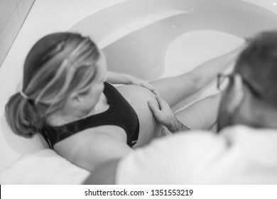 Pregnant Woman In Labour, Labor,  During Childbirth, Giving Birth, Birthing Pool, Water Bath
