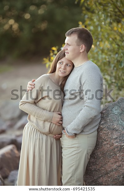 Pregnant Woman Long Dress Hugging Her Stock Photo Edit Now 695421535