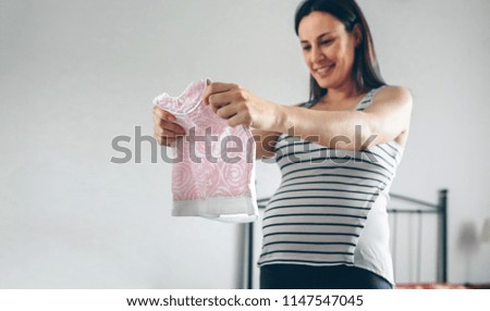 Similar – Image, Stock Photo Pregnant woman looking baby girl body