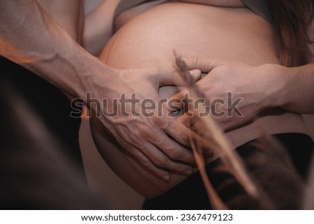 Pregnant woman man and woman hands on stomach. health pregnancy motherhood procreation concept. close-up belly of a pregnant woman. woman waiting for a newborn baby.