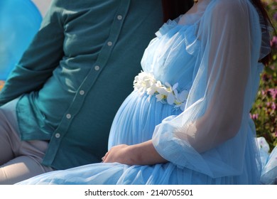 Pregnant woman and man photo shoot in mustard field. Selective focus. Grain filter, noise effect. - Powered by Shutterstock