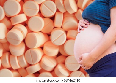 Pregnant Woman With Medication Tablets And Pills, Drug Use In Pregnancy Concept