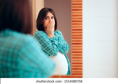 Pregnant Woman With Morning Sickness Looking In The Mirror. Woman Experiencing Pregnancy Difficulties In Her Last Trimester 
