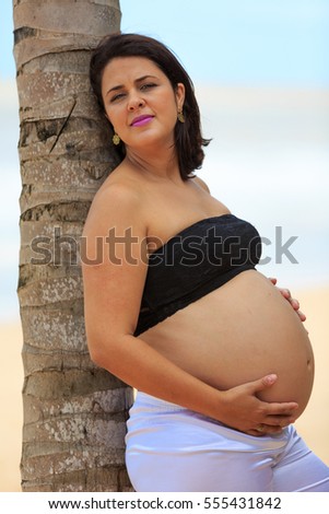 Pregnant woman on the beach 