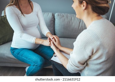 Pregnant Woman On Home Counselling Meeting. You're Not In This Alone. Depressed Pregnant Woman Consultation With Psychologist. Psychiatrist Holding Hands Patient,such As Making A Fresh Start