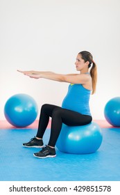 Pregnant woman on pilates ball
