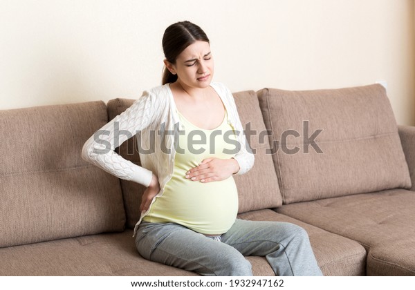 Pregnant Woman Painful Belly On Sofa Stock Photo (Edit Now) 1932947162