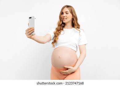 Pregnant Woman Patient Making Video Call With Doctor Online Via Mobile Phone, Home Medical Consultation And Telemedicine Concept, On White Background