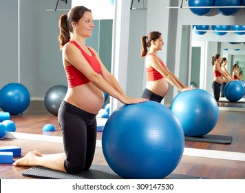 Pregnant Woman Pilates Fitball Exercise Workout At Gym Indoor