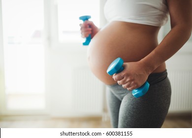 Pregnant woman practicing fitness and working out during pregnancy