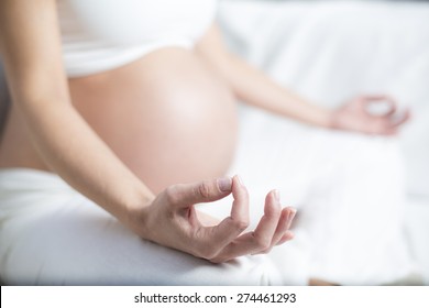 Pregnant Woman Practicing Yoga