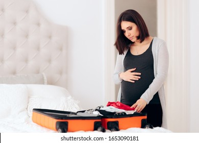 Pregnant Woman Preparing Huge Hospital Bag for Birth. Mother to be packing maternity bag getting ready
 - Powered by Shutterstock