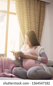 Pregnant Woman Reading Book.