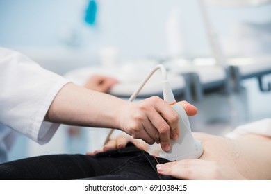 Pregnant woman receiving ultrasound treatment in hospital - Shutterstock ID 691038415